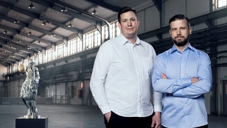 image of the impossible statue and two people